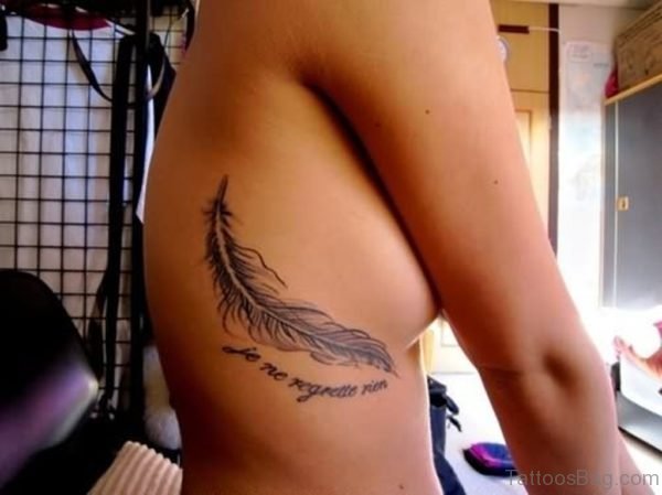 Feather And Word Tattoo On Rib