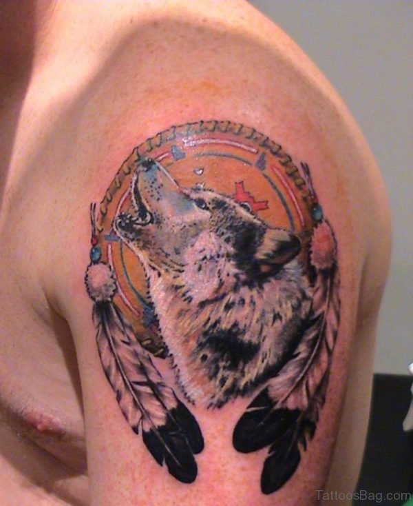 Feathers And Wolf Head Tattoo On Left Shoulder