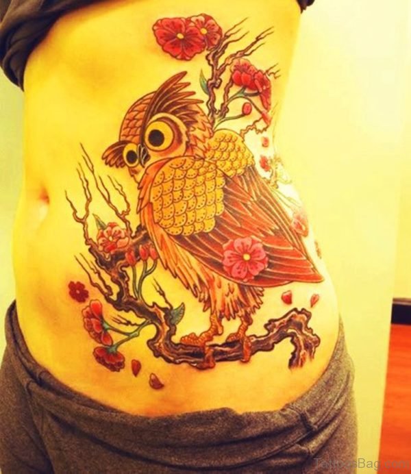 Flower Tree And Owl Sitting Tattoo On Side Rib