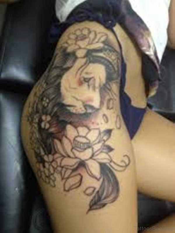 Flowers And Lion Tattoos On Thigh