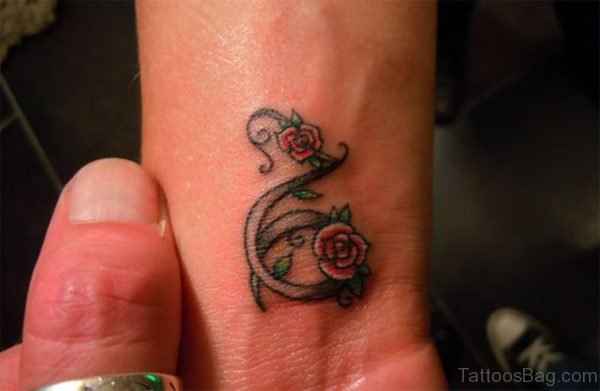 Flowers Capricorn Tattoo On Wrist