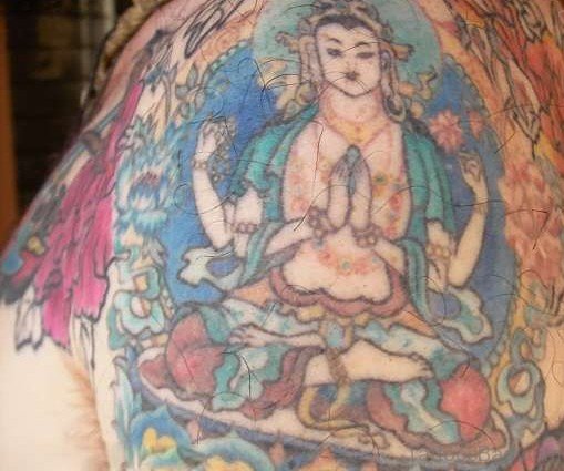 Funky Buddhist Tattoo On Shoulder