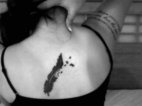 Funky Feather Tattoo On Back