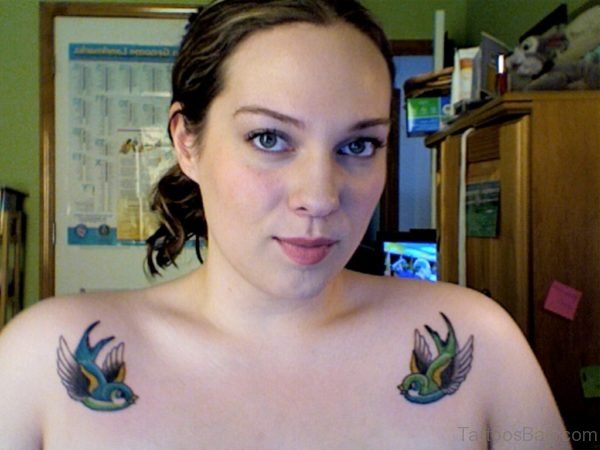Girl Showing Her Swallow Tattoo