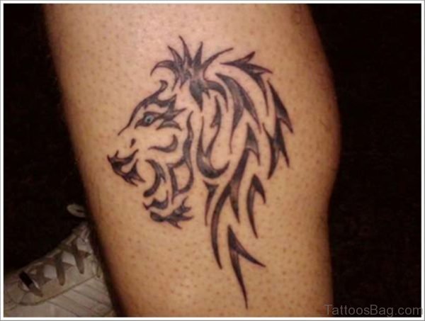 Glowing Tribal Lion Tattoo On Leg