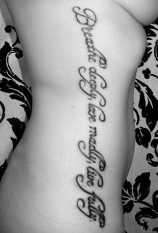 Gorgeous Ambigram Tattoo On Rib