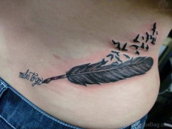 Graceful Feather Tattoo On Lower Back