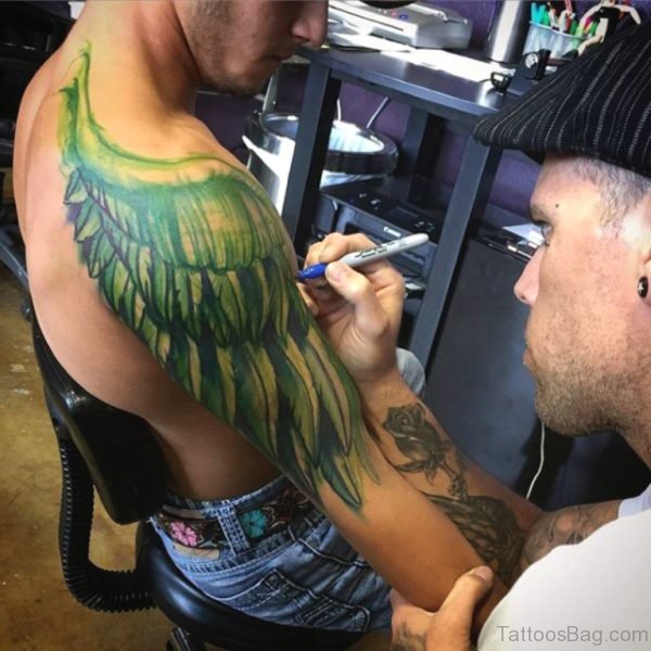 Green Colored Wings Tattoo