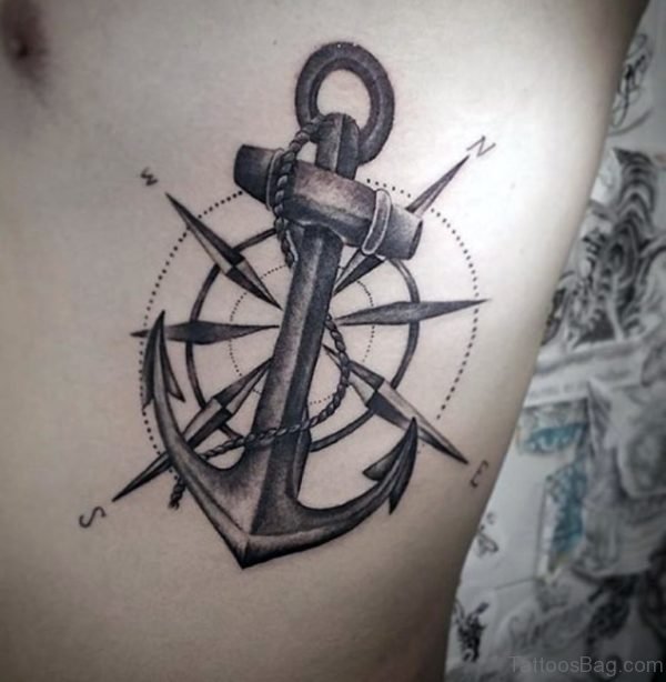 Grey Ink Anchor Compass Tattoo On Side Rib