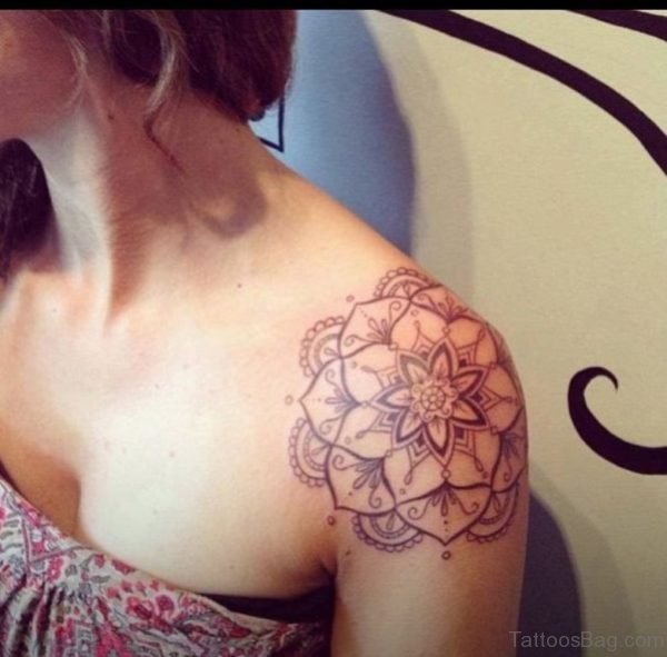 Grey Ink Flower Tattoo On Girl Left Shoulder