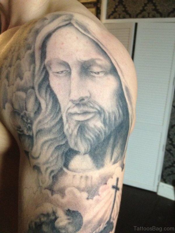 Grey Ink Jesus Portrait Tattoo On Shoulder