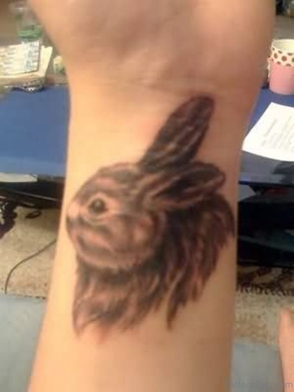 Grey Ink Rabbit Tattoo On Left Wrist
