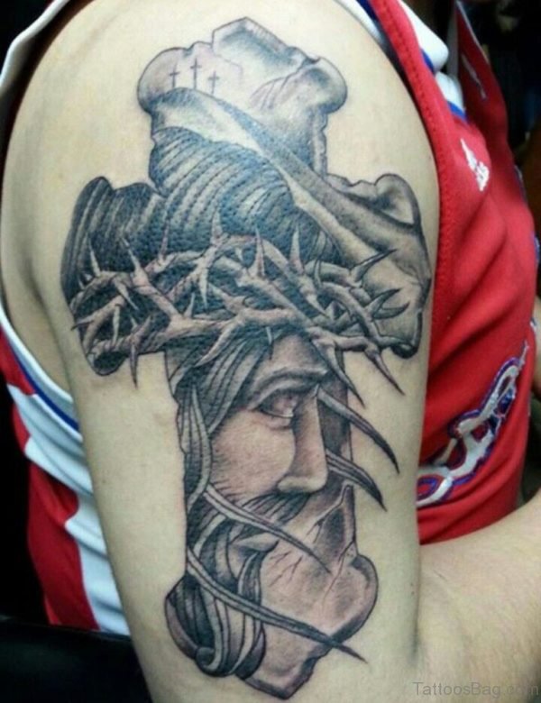 Grey Ink Sad Jesus And Cross Tattoo On Men Shoulder