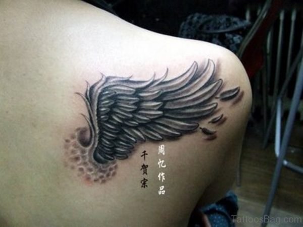 Grey Ink Shoulder Wings Tattoo
