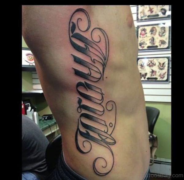 Grey Ink Side Rib Family Ambigram Tattoo