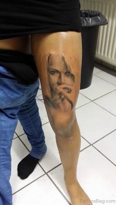 Grey Ink Woman Portrait Tattoo On Left Thigh