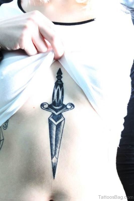 Grey Inked Dagger Tattoo On Stomach