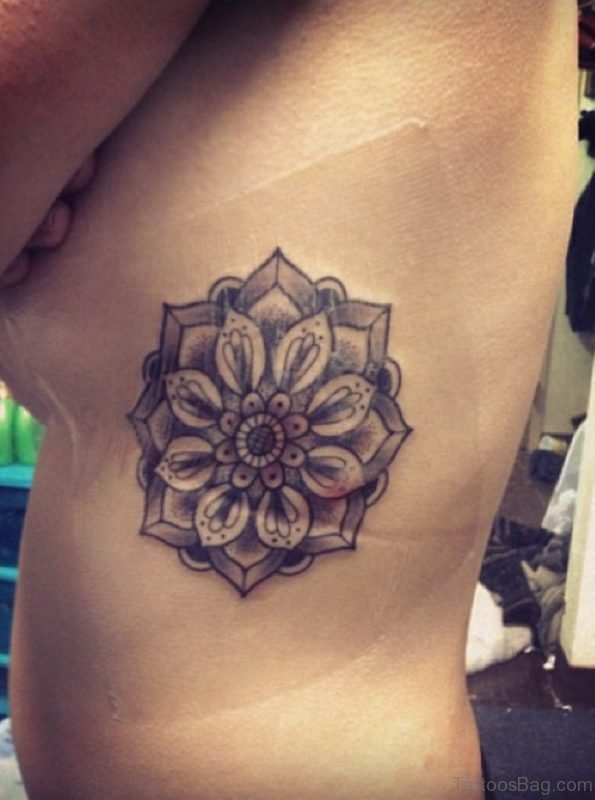 Grey Lotus Tattoo On Rib