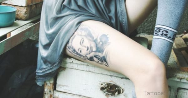 Grey Portrait Tattoo On Thigh