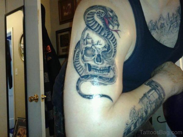 Grey Skull And Snake Tattoo 