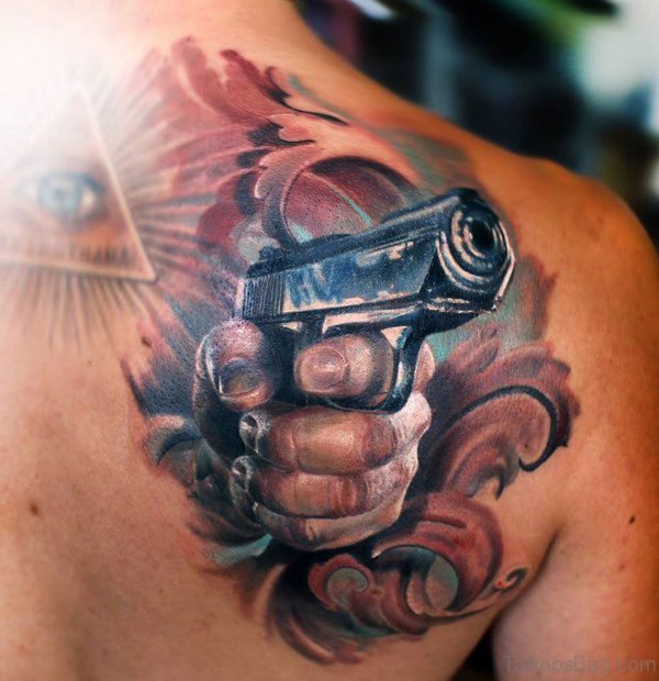Gun Shoulder Blade Tattoo Desig