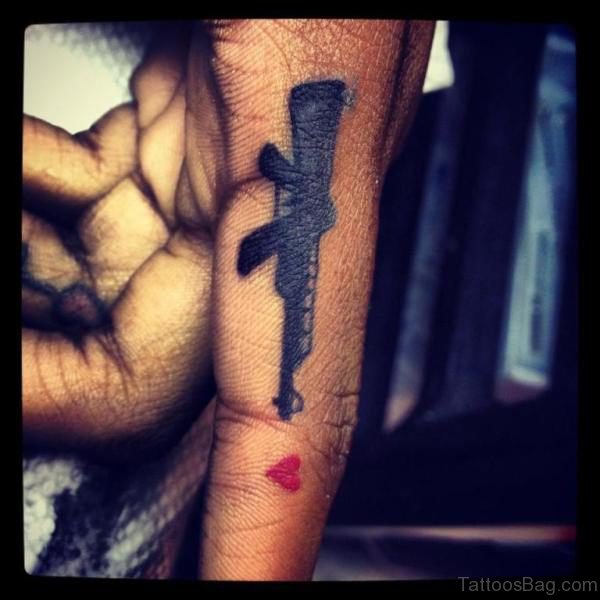 Gun Tattoo Design On Finger