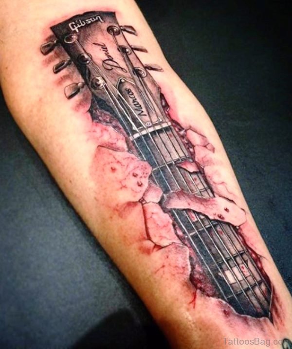 Hand Playing Guitar Tattoo On Forearm