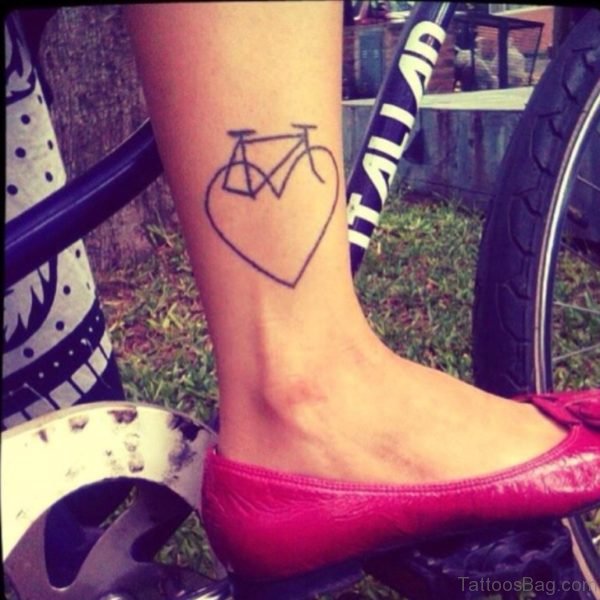 Heart And Bike Tattoo On Girl Right Leg