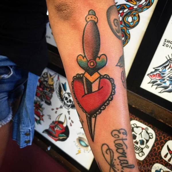 Heart With Dagger Tattoo On Arm