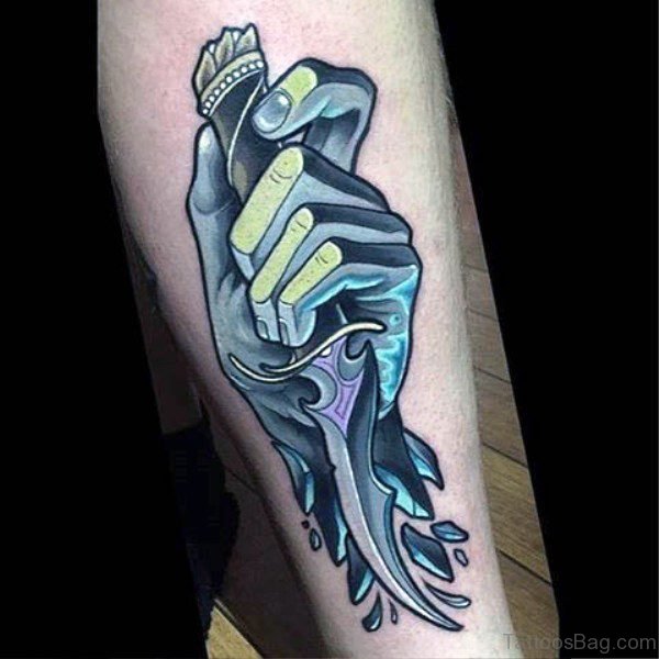 Icy Hand Holding Dagger Tattoo On Arm
