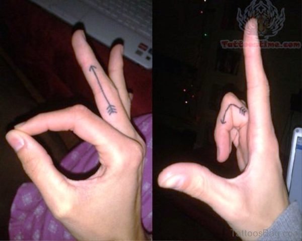Image Of Arrow Tattoo On Finger