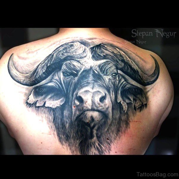 Impressive Black Bull Tattoo Face On Back