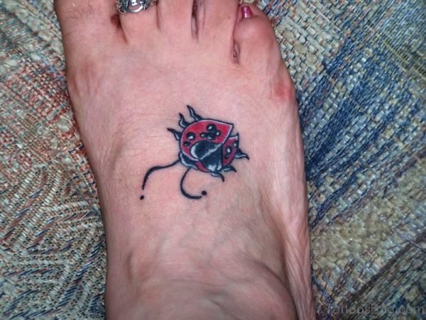 Impressive Ladybug Tattoo On Foot 