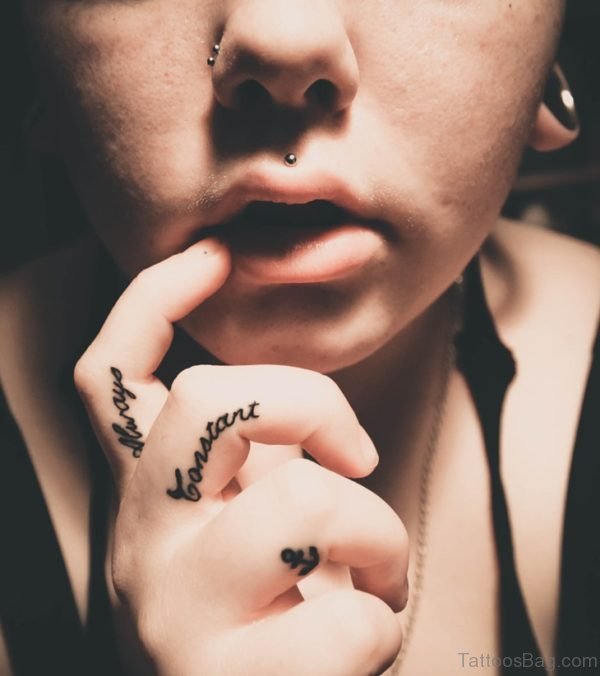 Impressive Word Tattoo On Finger