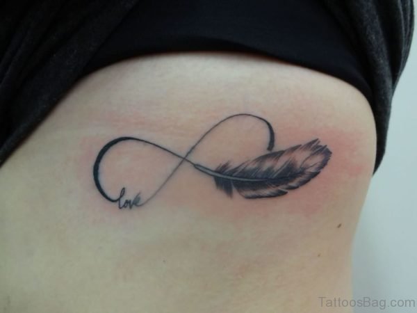 Infinity Love Symbol With Feather Tattoo On Side Rib