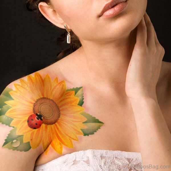 Lady Bug On Yellow Flower Tattoo