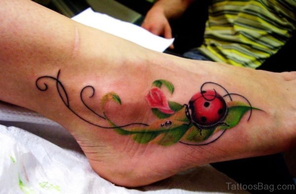 Ladybug On Leaves Tattoo On Foot 