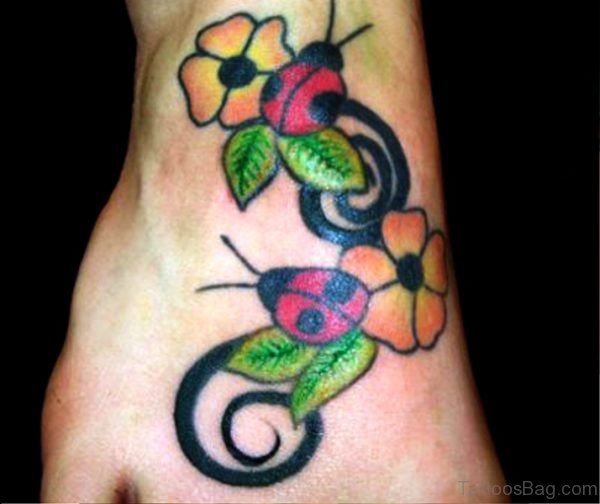 Ladybugs With Colorful Flowers Tattoo 