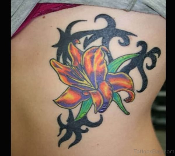 Lily Flower And Tribal Tattoo On Rib