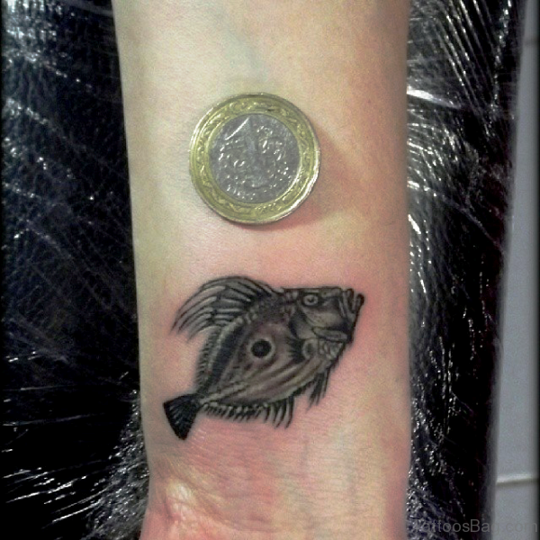 Little Black Fish Tattoo On Wrist 