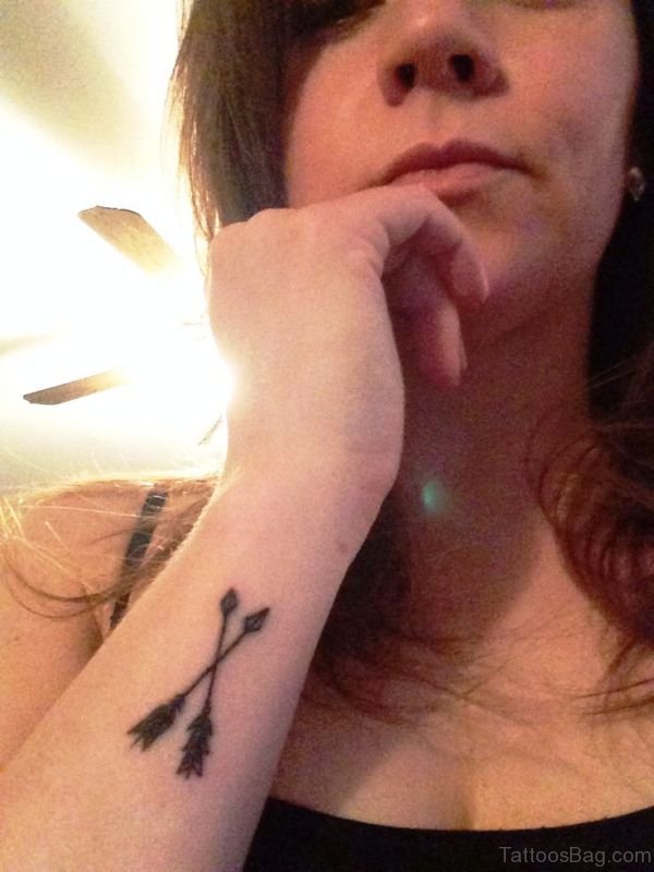 Little Cross Arrow Tattoo On Arm