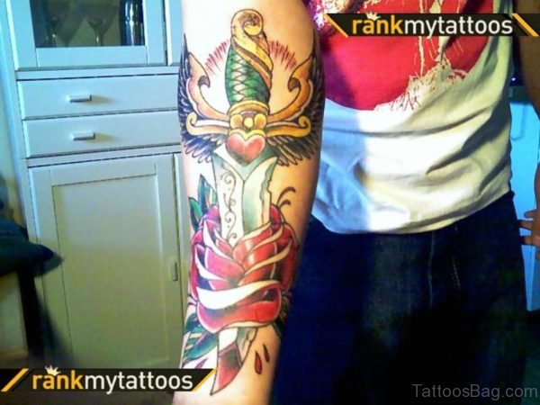 Long Colorful Dagger Tattoo On Arm