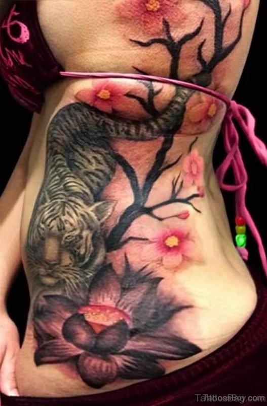 Lotus And iger Tattoo On Rib