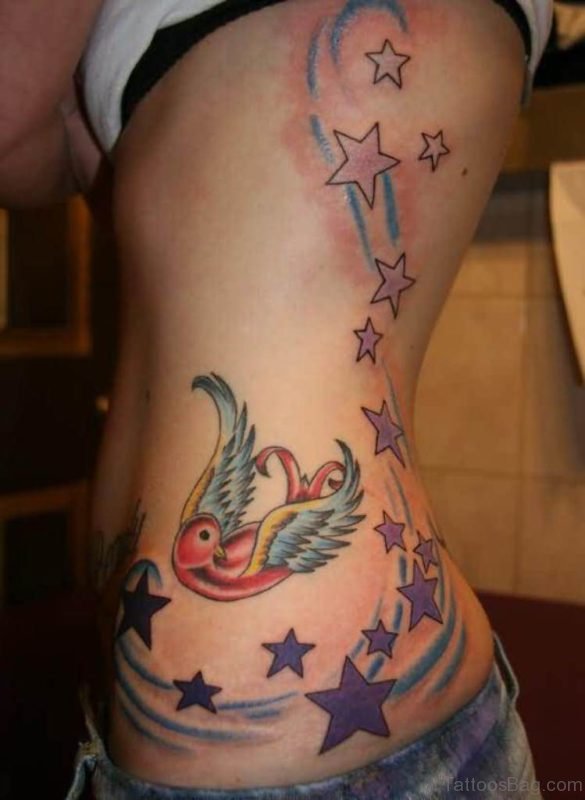 Lovely Stars Color Bird Tattoo On Rib