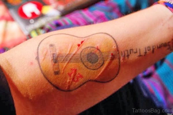 Magnificent Guitar Tattoo On Forearm