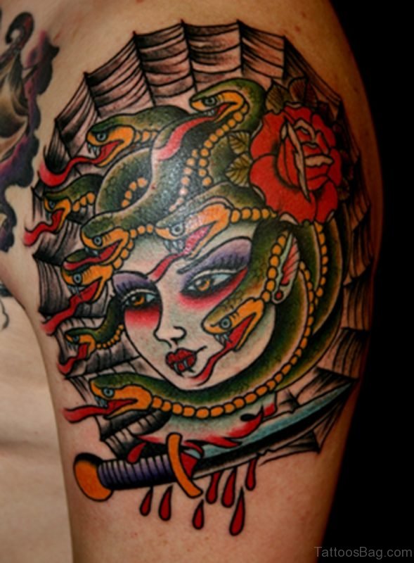 Medusa And Dagger Tattoo On Shoulder