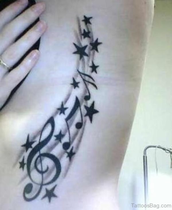 Music Notes And Stars Tattoo