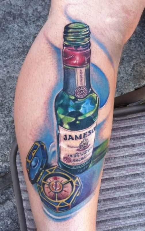 Nautical Compass And Bottle Tattoo On Leg