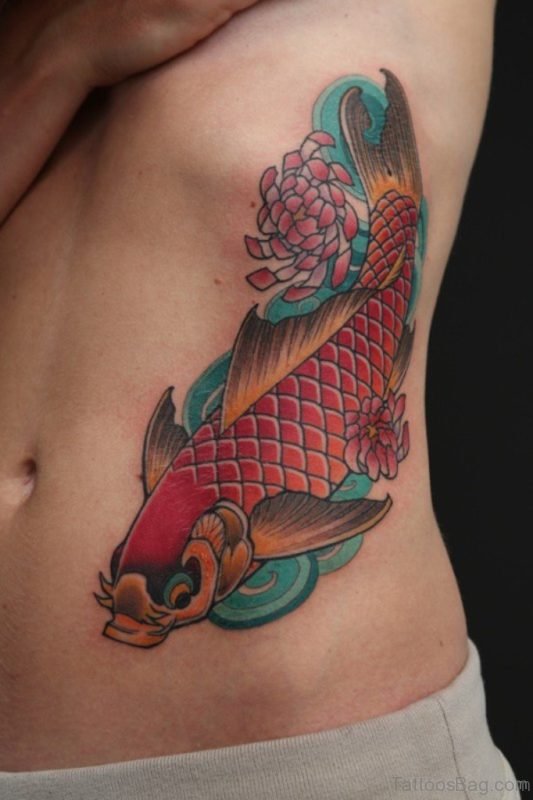 Nice Colored Fish Tattoo On Rib