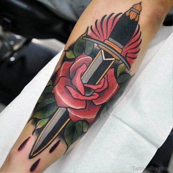Nice Dagger Tattoo On Arm